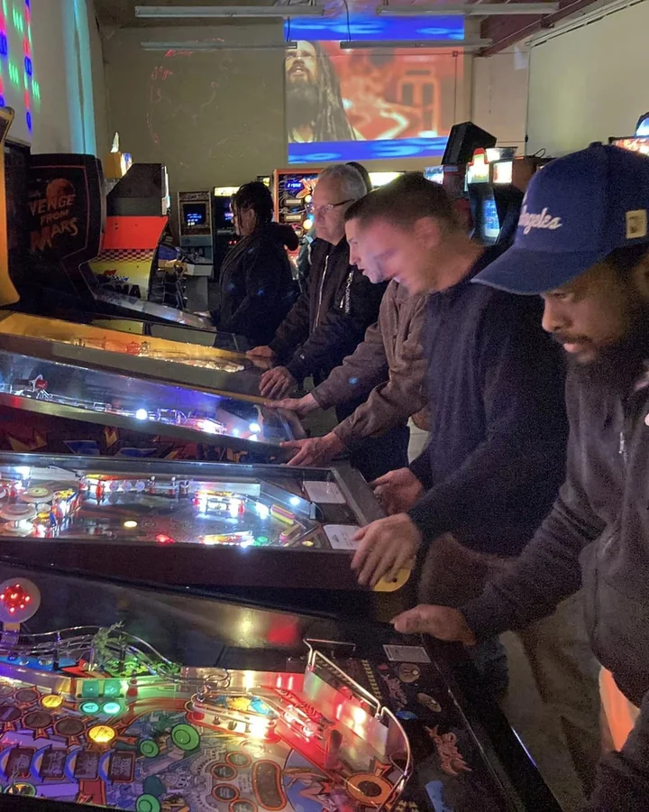 Players lined up at the pinball machines inside Y2Kade Classic Arcade in Bellflower